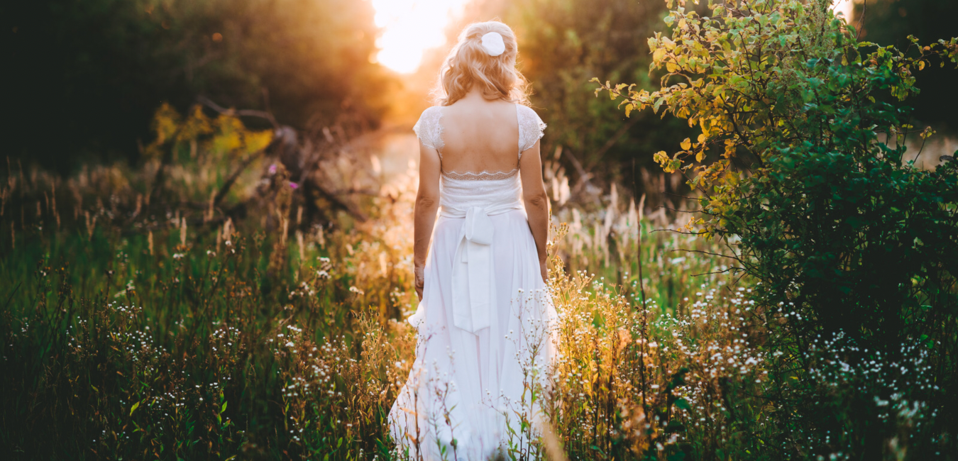 Bride Walking Through Grass Jewelz Galore